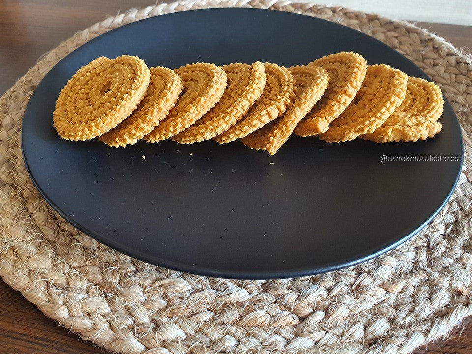 Handcrafted using generational recipes, our Bhajani Chakli brings the warmth of home and the magic of authentic spices to your plate.